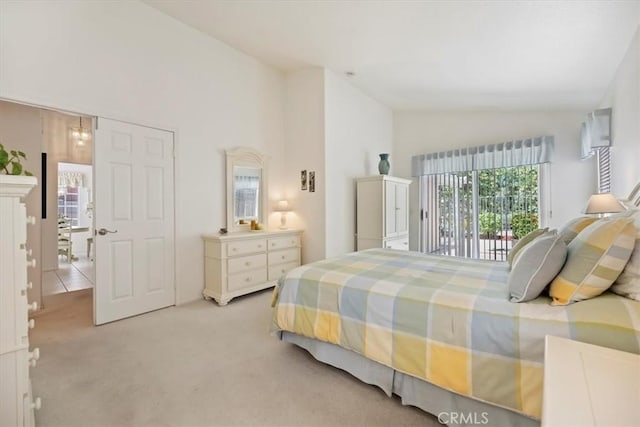 40209 Corte Peralta, Murrieta, CA 92562 - bedroom featuring vaulted ceiling, light colored carpet, and access to outside