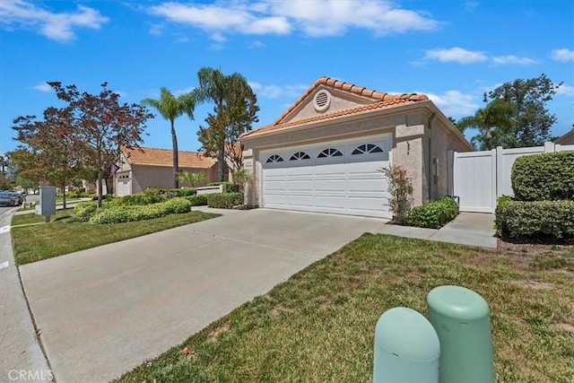 40209 Corte Peralta, Murrieta, CA 92562 - view of front of home featuring a tile roof, stucco siding, and driveway