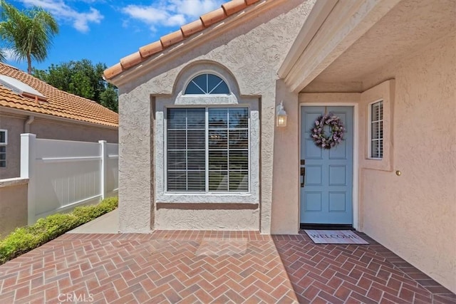 40209 Corte Peralta, Murrieta, CA 92562 - doorway to property featuring stucco siding and a tiled roof