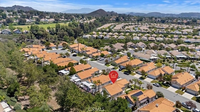40209 Corte Peralta, Murrieta, CA 92562 - aerial view of property's location with a mountain backdrop and nearby suburban area