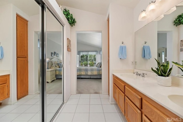 40209 Corte Peralta, Murrieta, CA 92562 - bathroom featuring ensuite bathroom, lofted ceiling, double vanity, and tile patterned flooring