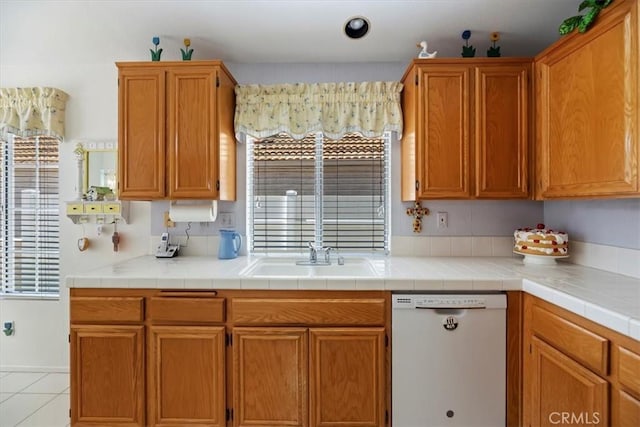 40209 Corte Peralta, Murrieta, CA 92562 - kitchen featuring dishwasher, healthy amount of natural light, light tile patterned floors, and light countertops