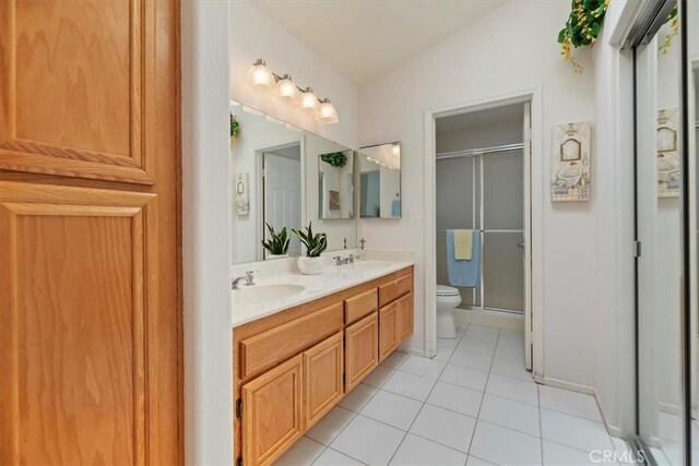 40209 Corte Peralta, Murrieta, CA 92562 - full bathroom featuring double vanity, a shower stall, and tile patterned floors