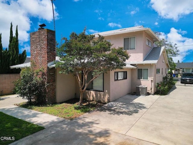 5026 Doreen Ave, Temple City, CA 91780 - view of front of property with stucco siding, a patio area, and a chimney