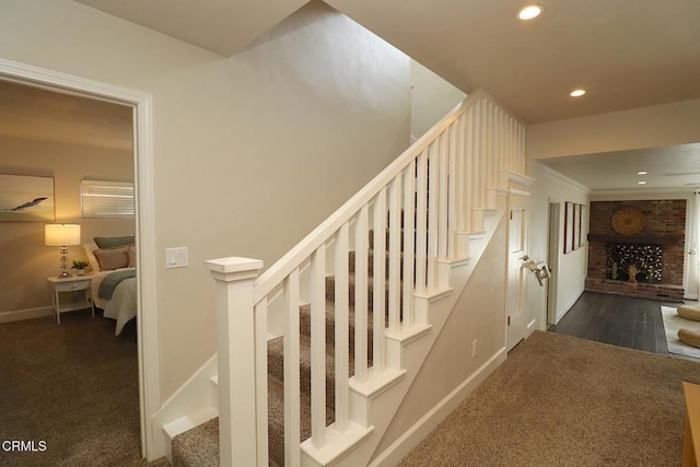 5026 Doreen Ave, Temple City, CA 91780 - staircase featuring a brick fireplace, recessed lighting, and carpet floors