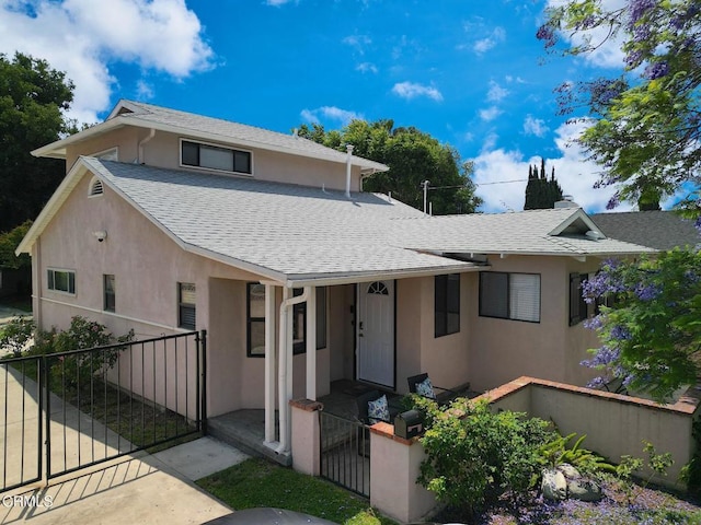 5026 Doreen Ave, Temple City, CA 91780 - view of front facade with a shingled roof, stucco siding, and a fenced front yard