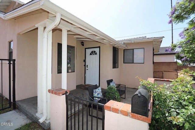 5026 Doreen Ave, Temple City, CA 91780 - doorway to property with stucco siding and a gate
