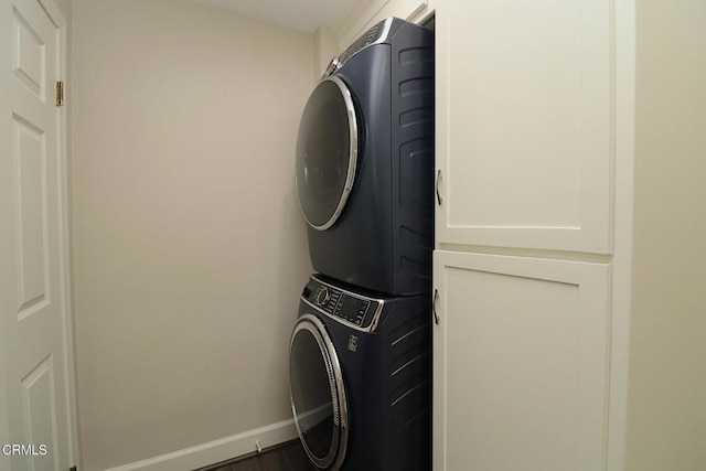 5026 Doreen Ave, Temple City, CA 91780 - laundry room with stacked washer and clothes dryer and baseboards