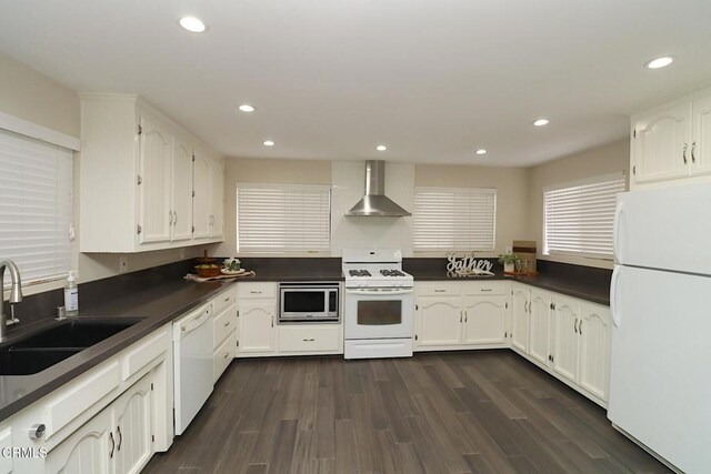 5026 Doreen Ave, Temple City, CA 91780 - kitchen with white appliances, wall chimney range hood, dark countertops, white cabinets, and recessed lighting