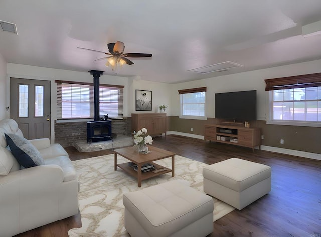 1390 Dewey Pl, Campo, CA 91906 - living room featuring a wood stove, plenty of natural light, wood finished floors, and a ceiling fan