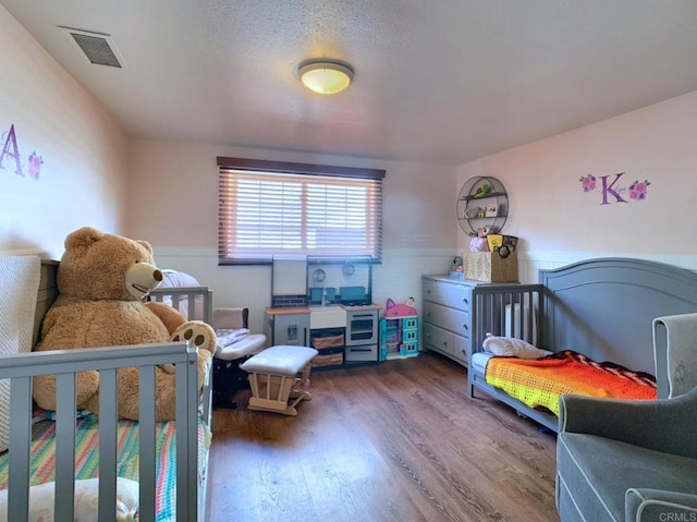 1390 Dewey Pl, Campo, CA 91906 - bedroom with a wainscoted wall and wood finished floors