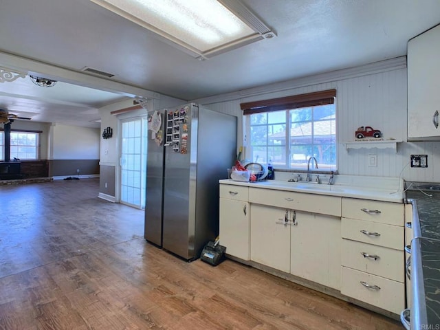 1390 Dewey Pl, Campo, CA 91906 - kitchen featuring light wood-type flooring, freestanding refrigerator, white cabinets, and ceiling fan