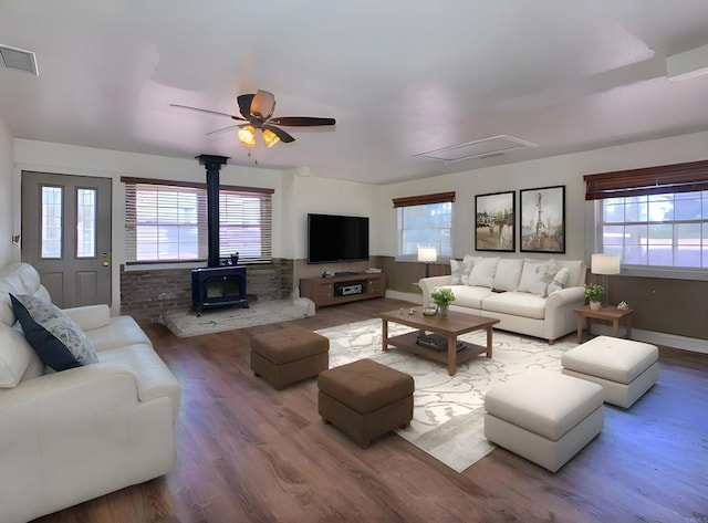 1390 Dewey Pl, Campo, CA 91906 - living room featuring a wood stove, healthy amount of natural light, ceiling fan, and wood finished floors