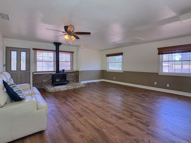 1390 Dewey Pl, Campo, CA 91906 - unfurnished living room with a wood stove, wood finished floors, and a ceiling fan