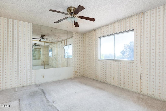 2026 Thomas Pl, West Covina, CA 91792 - carpeted empty room with plenty of natural light, a textured ceiling, and ceiling fan