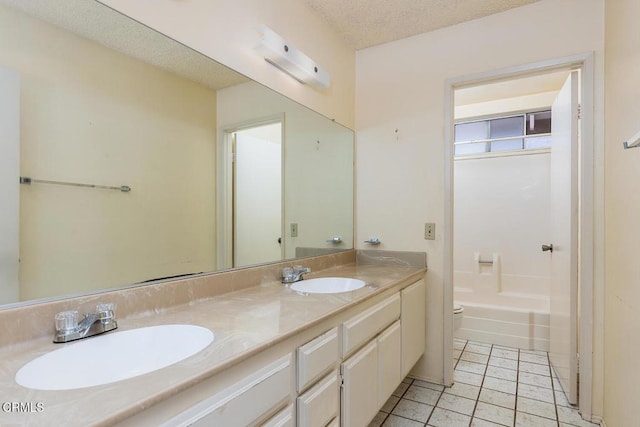 2026 Thomas Pl, West Covina, CA 91792 - full bathroom with double vanity, tile patterned flooring, a textured ceiling, and a wall mounted air conditioner