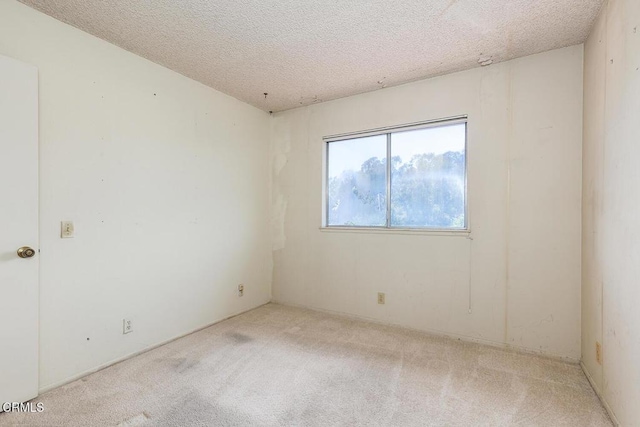 2026 Thomas Pl, West Covina, CA 91792 - unfurnished room with carpet and a textured ceiling