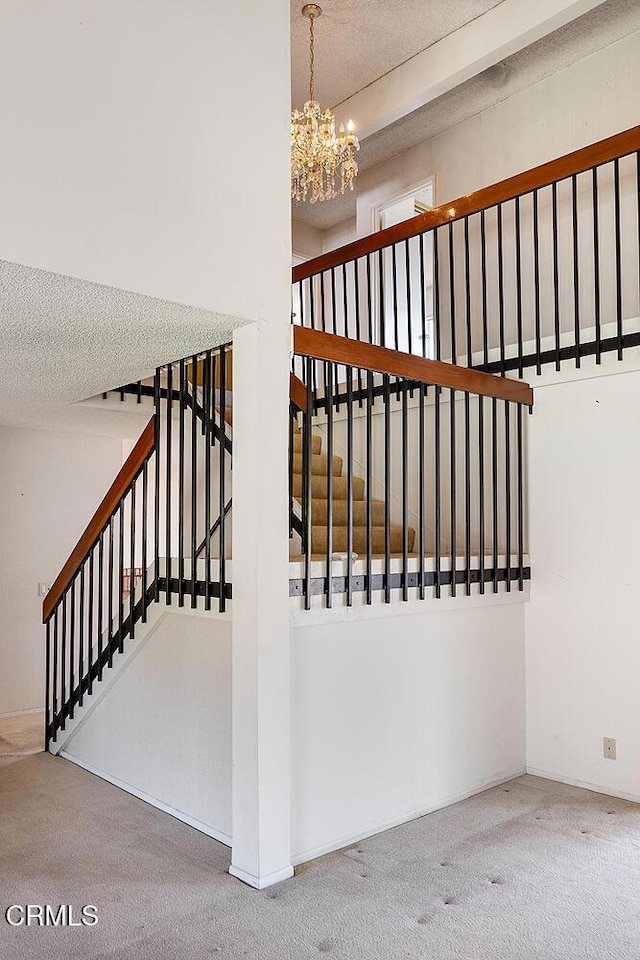 2026 Thomas Pl, West Covina, CA 91792 - stairs featuring carpet flooring, a chandelier, and a textured ceiling