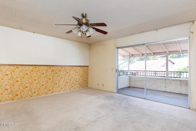2026 Thomas Pl, West Covina, CA 91792 - carpeted empty room with wallpapered walls, ceiling fan, a textured ceiling, and a sunroom