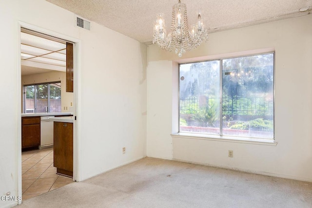2026 Thomas Pl, West Covina, CA 91792 - unfurnished dining area with a chandelier, a textured ceiling, and light carpet