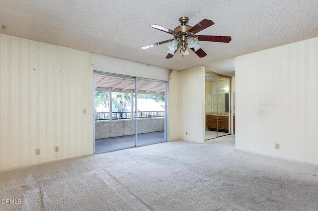 2026 Thomas Pl, West Covina, CA 91792 - carpeted spare room with ceiling fan, a textured ceiling, and wallpapered walls