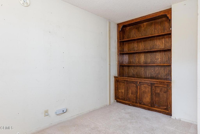 2026 Thomas Pl, West Covina, CA 91792 - unfurnished room with light colored carpet and a textured ceiling