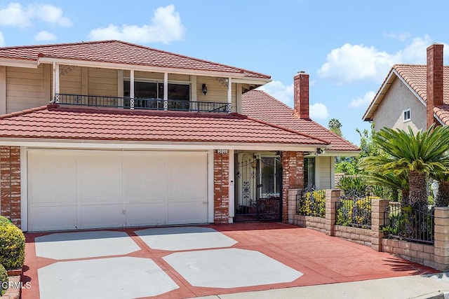 2026 Thomas Pl, West Covina, CA 91792 - view of front of house with a tile roof, a balcony, driveway, and brick siding