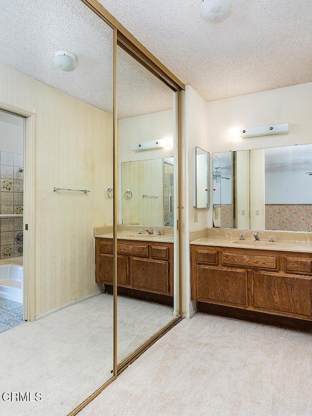 2026 Thomas Pl, West Covina, CA 91792 - full bath with vanity, a tub, and a textured ceiling