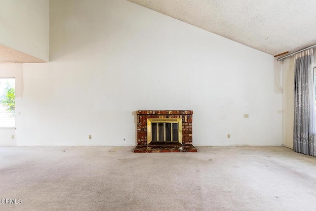 2026 Thomas Pl, West Covina, CA 91792 - unfurnished living room with high vaulted ceiling, carpet floors, and a brick fireplace