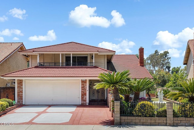 2026 Thomas Pl, West Covina, CA 91792 - view of front facade with a tile roof, a balcony, concrete driveway, an attached garage, and brick siding