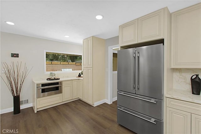 1604 N Laurel Ave, Upland, CA 91784 - kitchen featuring stainless steel appliances, cream cabinets, dark wood finished floors, and recessed lighting