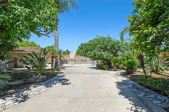 1604 N Laurel Ave, Upland, CA 91784 - view of property hidden behind natural elements with a gate