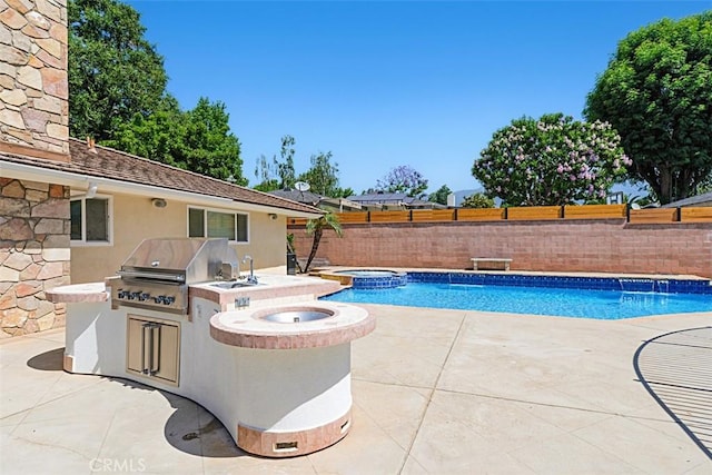 1604 N Laurel Ave, Upland, CA 91784 - view of swimming pool with exterior kitchen, a patio area, a fenced backyard, and a pool with connected hot tub