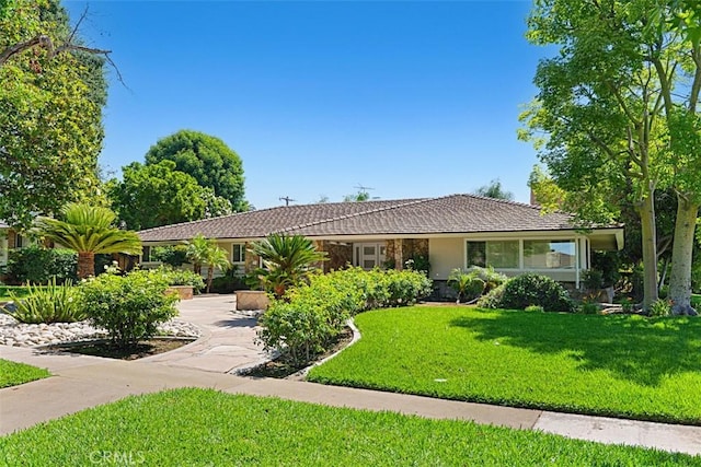 1604 N Laurel Ave, Upland, CA 91784 - ranch-style house with a front lawn, stucco siding, and a tile roof