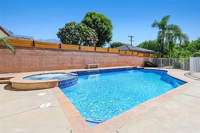 1604 N Laurel Ave, Upland, CA 91784 - view of pool featuring a fenced backyard, a pool with connected hot tub, and a patio area