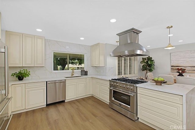 1604 N Laurel Ave, Upland, CA 91784 - kitchen featuring stainless steel appliances, island exhaust hood, cream cabinetry, decorative backsplash, and recessed lighting