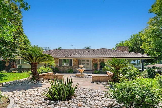 1604 N Laurel Ave, Upland, CA 91784 - single story home featuring a chimney, stone siding, and french doors