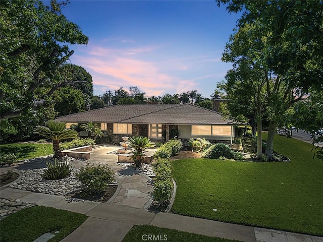 1604 N Laurel Ave, Upland, CA 91784 - view of front of home featuring a lawn, a tiled roof, concrete driveway, and stucco siding