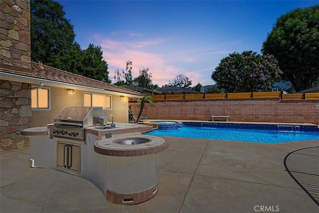 1604 N Laurel Ave, Upland, CA 91784 - view of swimming pool featuring an outdoor kitchen, a patio, a fenced backyard, and a pool with connected hot tub