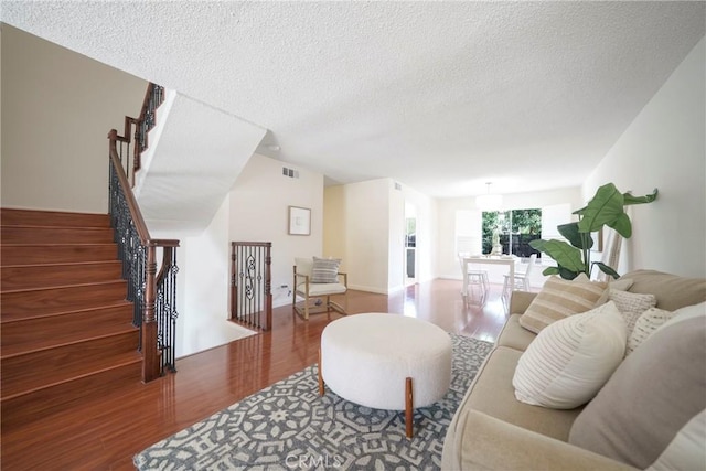 1927 Huntington Dr Unit C, Duarte, CA 91010 - living area featuring wood finished floors, a textured ceiling, and stairway