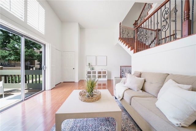 1927 Huntington Dr Unit C, Duarte, CA 91010 - living area with a high ceiling, wood finished floors, and stairway