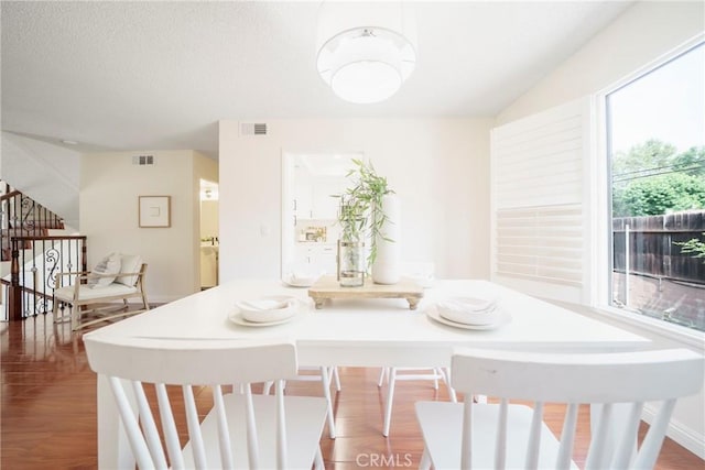 1927 Huntington Dr Unit C, Duarte, CA 91010 - dining room with healthy amount of natural light, stairs, and wood finished floors
