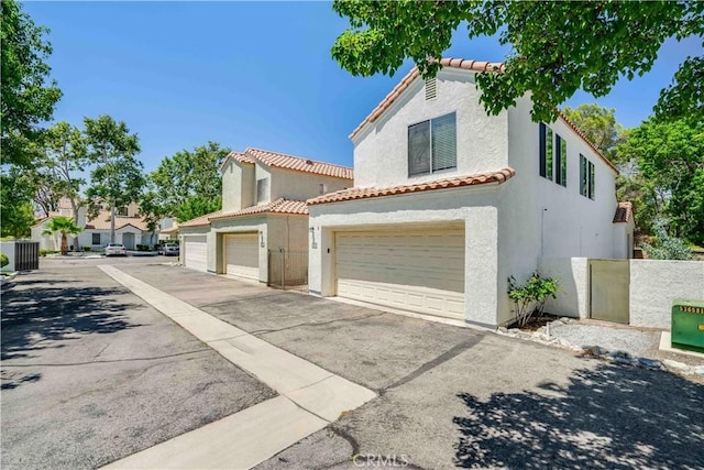 37940 42nd St E Unit 129, Palmdale, CA 93552 - mediterranean / spanish house featuring stucco siding and a tile roof