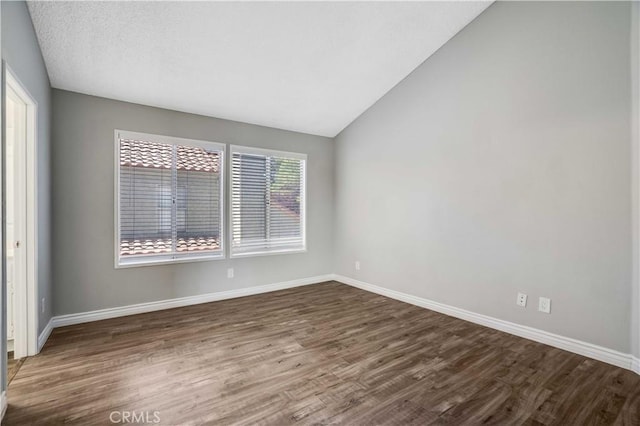 37940 42nd St E Unit 129, Palmdale, CA 93552 - empty room featuring dark wood-style flooring and lofted ceiling