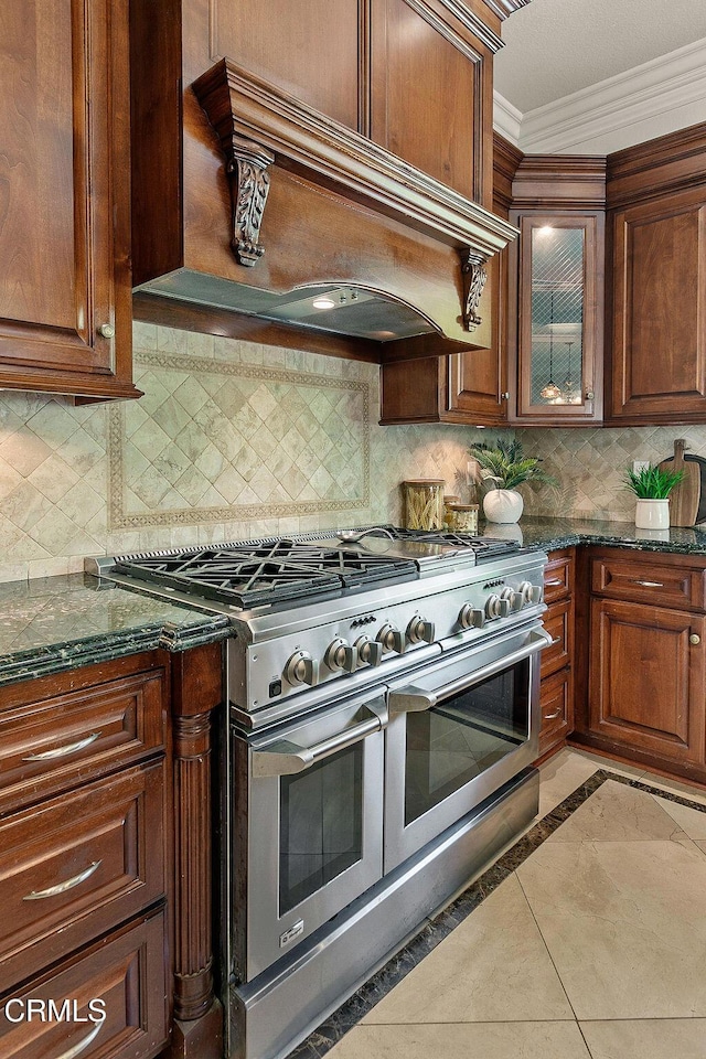 2981 Yucca Dr, Camarillo, CA 93012 - kitchen featuring double oven range, custom range hood, inlaid floor details, ornamental molding, and dark stone countertops