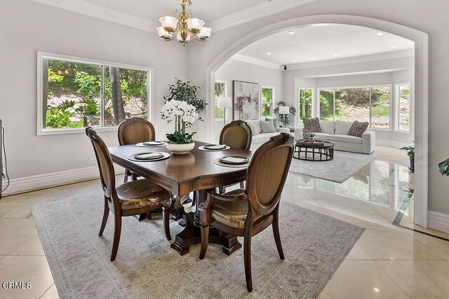 2981 Yucca Dr, Camarillo, CA 93012 - dining room featuring arched walkways, light tile patterned floors, a chandelier, crown molding, and recessed lighting
