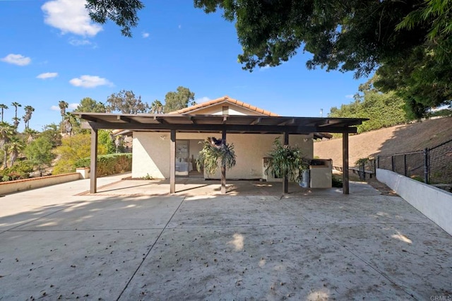 917 Gretna Green Way, Escondido, CA 92025 - back of property featuring stucco siding and a tiled roof