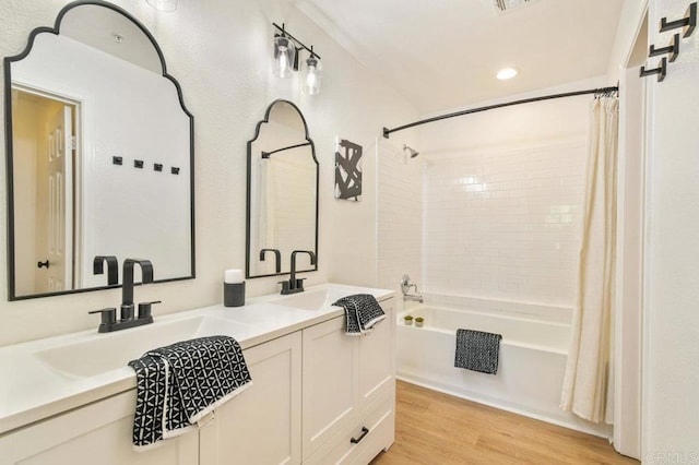 1948 Caminito De La Cruz, Chula Vista, CA 91913 - bathroom with shower / bath combination with curtain, double vanity, wood finished floors, and recessed lighting