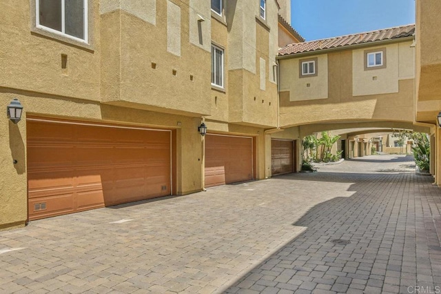 1948 Caminito De La Cruz, Chula Vista, CA 91913 - view of front of property with an attached garage, stucco siding, driveway, and a tile roof
