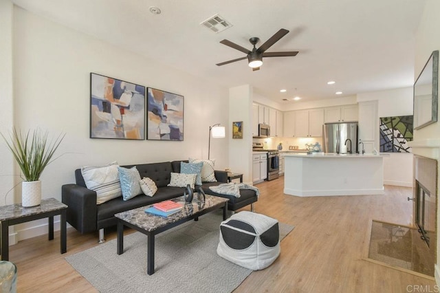 1948 Caminito De La Cruz, Chula Vista, CA 91913 - living room with a ceiling fan, light wood-type flooring, and recessed lighting